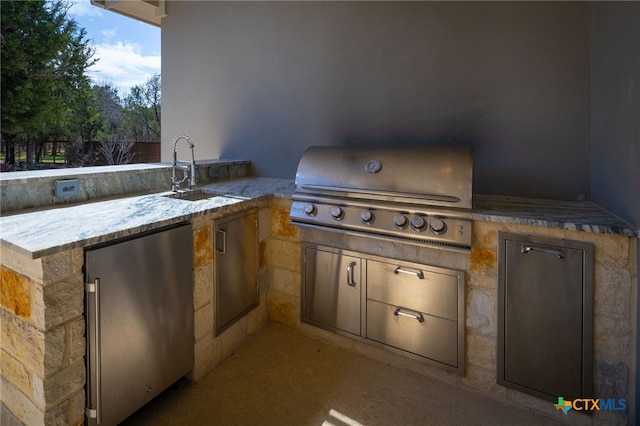 view of patio / terrace featuring grilling area and a sink