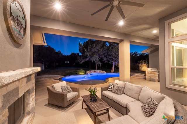 view of patio / terrace featuring an outdoor pool, an outdoor hangout area, and ceiling fan