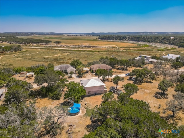 birds eye view of property featuring a rural view