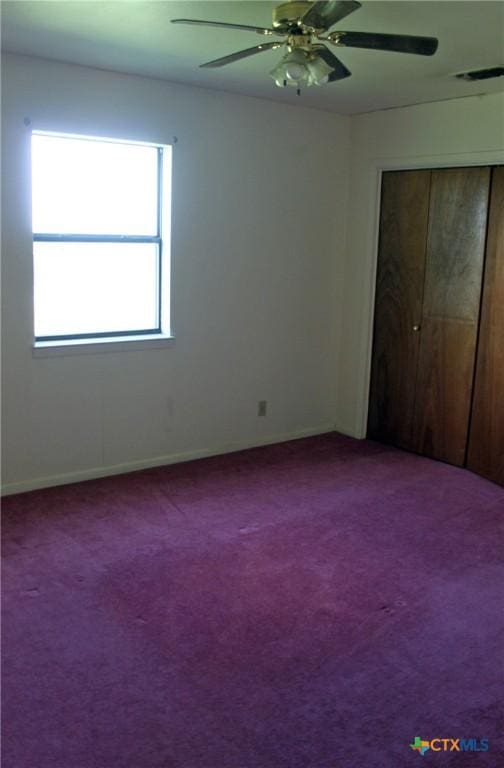 854 Pettytown Rd, Red Rock, TX 78662 - unfurnished bedroom with carpet floors, a closet, baseboards, and ceiling fan