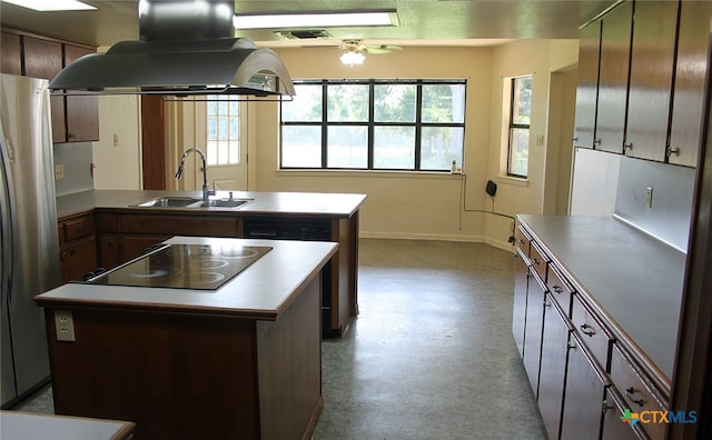 kitchen with a center island, island range hood, sink, ceiling fan, and appliances with stainless steel finishes