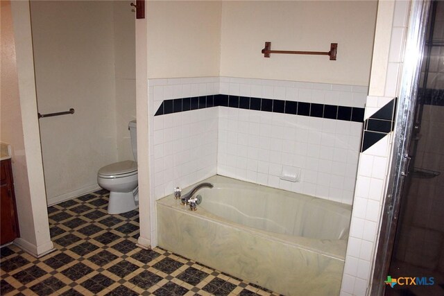 854 Pettytown Rd, Red Rock, TX 78662 - full bathroom with toilet, a bath, and tile patterned floors