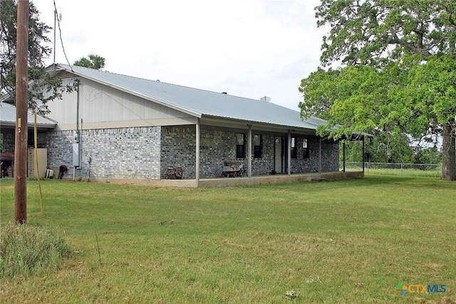 854 Pettytown Rd, Red Rock, TX 78662 - rear view of property with brick siding and metal roof