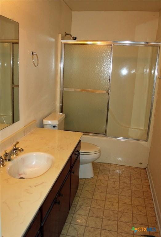 854 Pettytown Rd, Red Rock, TX 78662 - bathroom featuring toilet, vanity, and enclosed tub / shower combo
