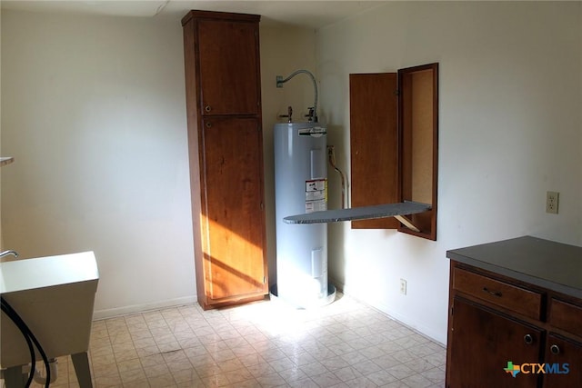 854 Pettytown Rd, Red Rock, TX 78662 - unfurnished dining area with water heater and baseboards