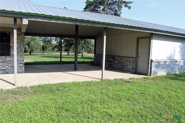 view of parking / parking lot with a lawn