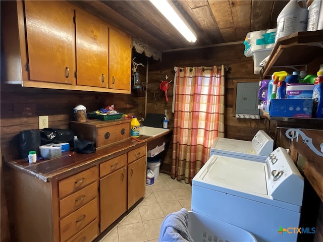 laundry room with electric panel, wooden walls, wooden ceiling, and separate washer and dryer