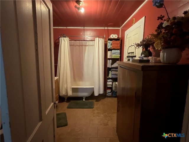 interior space with shower / tub combo with curtain and wooden ceiling