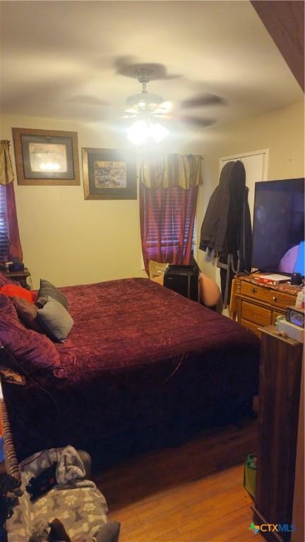 701 E Anaqua Ave, Victoria, TX 77901 - bedroom featuring wood finished floors and ceiling fan