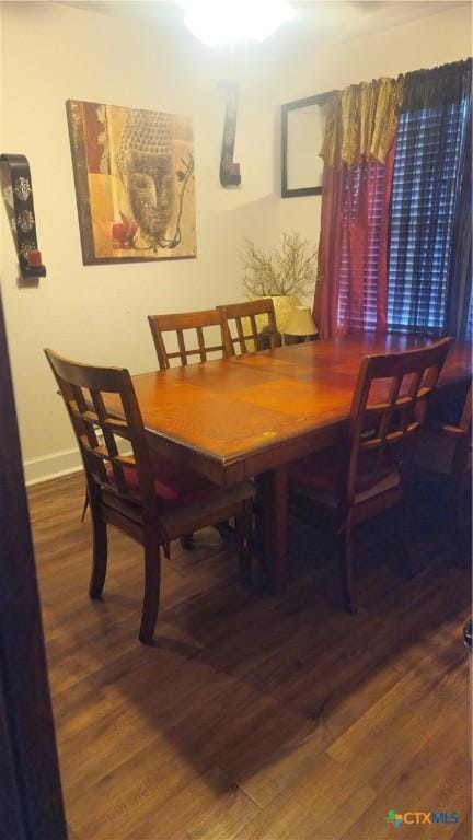 701 E Anaqua Ave, Victoria, TX 77901 - dining area with wood finished floors and baseboards