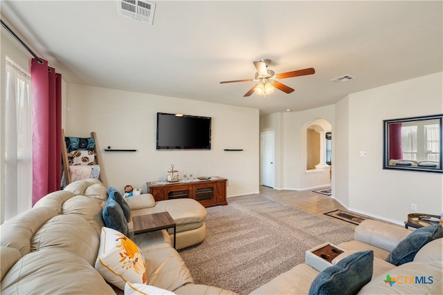 living room featuring ceiling fan and light tile patterned floors