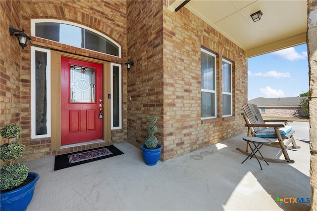 doorway to property with a porch