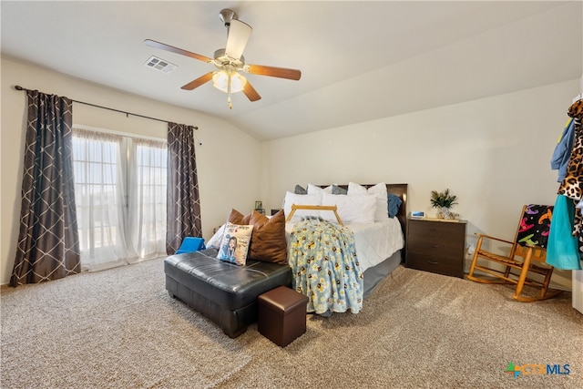 carpeted bedroom with ceiling fan and lofted ceiling