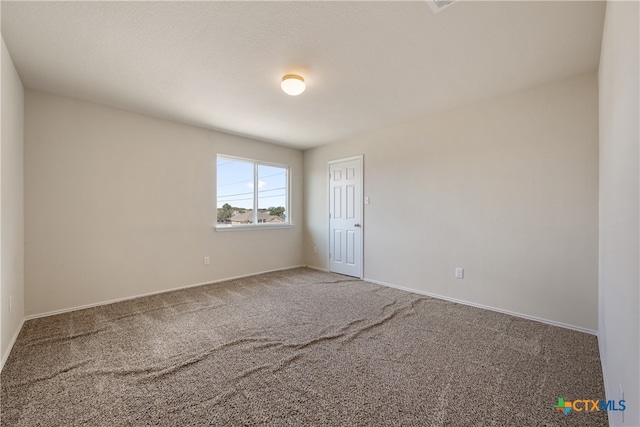 view of carpeted spare room