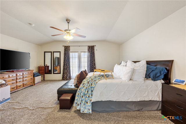 carpeted bedroom with ceiling fan and lofted ceiling