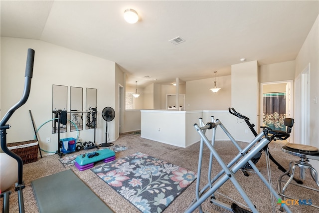 workout area with light colored carpet and lofted ceiling