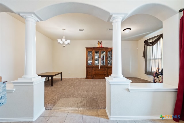 interior space with light carpet and an inviting chandelier