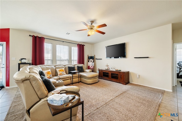 tiled living room featuring ceiling fan