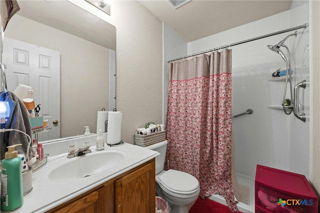 bathroom with a shower with curtain, vanity, and toilet