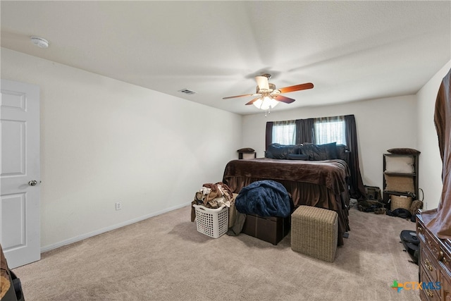 bedroom featuring ceiling fan and light colored carpet