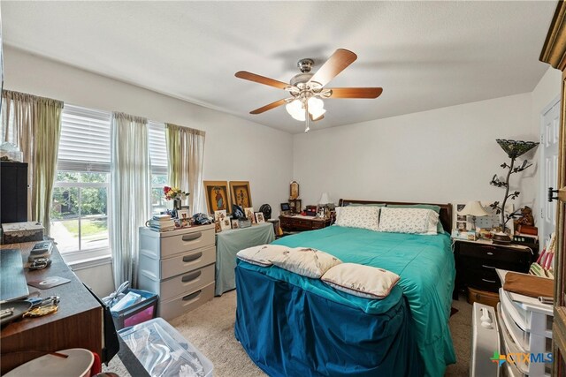 carpeted bedroom with ceiling fan