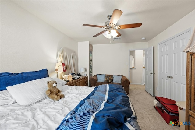 carpeted bedroom with ceiling fan