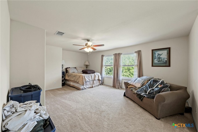 bedroom featuring light colored carpet and ceiling fan