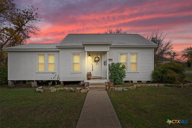 view of front of house with a lawn