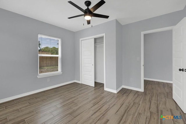 5073 Cedarside, San Marcos, TX 78666 - unfurnished bedroom featuring wood finished floors, a closet, and a ceiling fan