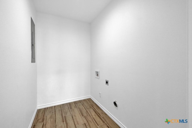 5073 Cedarside, San Marcos, TX 78666 - laundry area featuring electric dryer hookup, hookup for a washing machine, wood finished floors, and electric panel