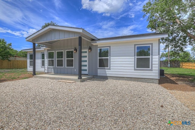 5073 Cedarside, San Marcos, TX 78666 - view of front facade with a patio and board and batten siding