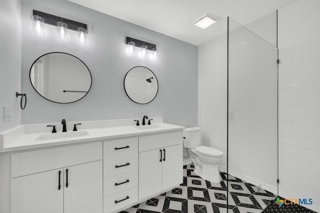 5073 Cedarside, San Marcos, TX 78666 - bathroom with double vanity, tile patterned flooring, and tiled shower