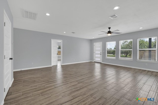5073 Cedarside, San Marcos, TX 78666 - unfurnished living room featuring ceiling fan, wood finished floors, and recessed lighting