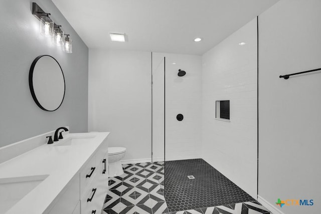 5073 Cedarside, San Marcos, TX 78666 - bathroom with double vanity, walk in shower, recessed lighting, and tile patterned floors