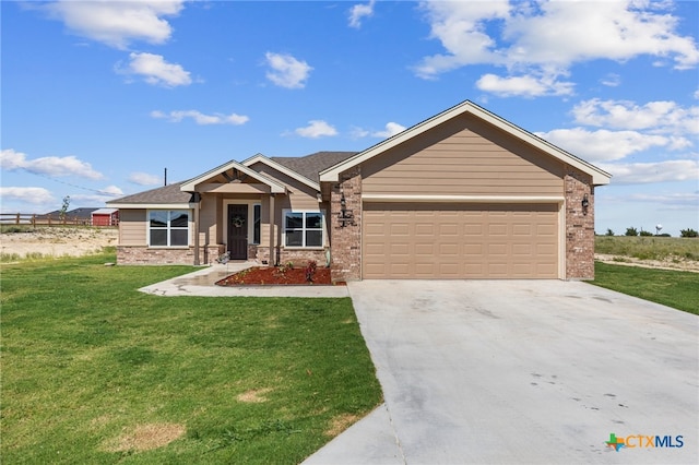 view of front of house featuring a front lawn and a garage