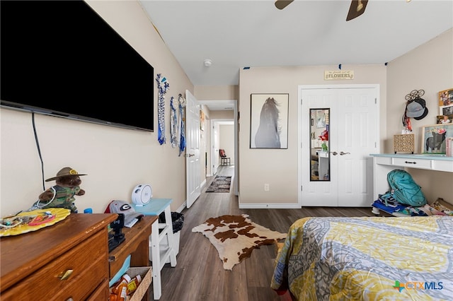 bedroom featuring ceiling fan and dark hardwood / wood-style floors