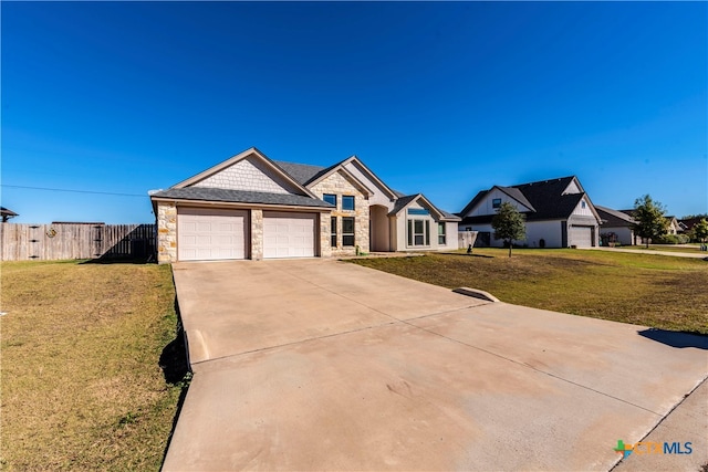 ranch-style home featuring a garage and a front lawn