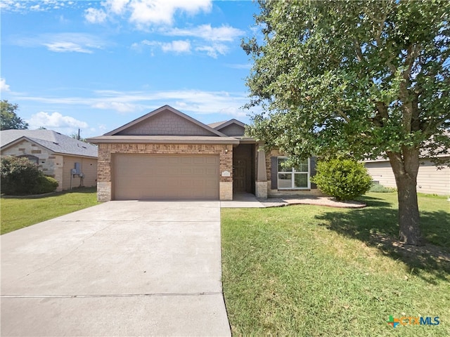 view of front facade with a garage and a front lawn