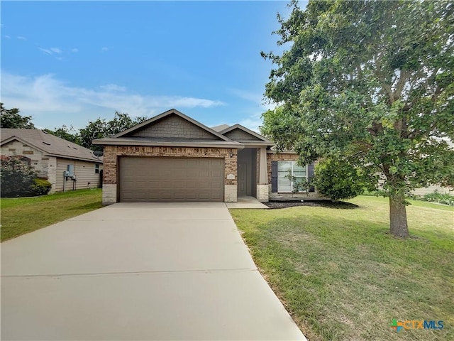 view of front of property with a garage and a front yard