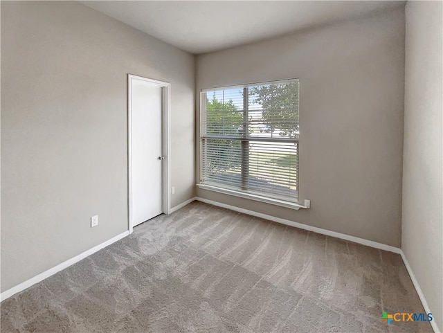 unfurnished room featuring carpet flooring