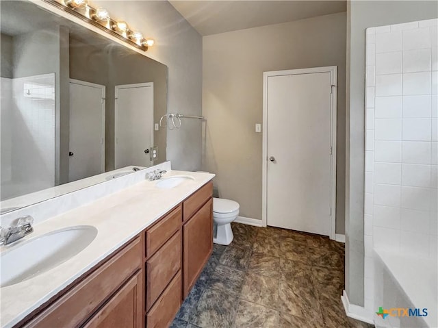 bathroom featuring a shower, vanity, and toilet