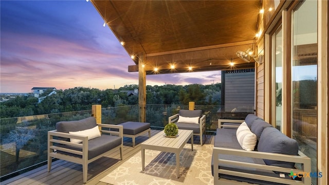 patio terrace at dusk with an outdoor living space