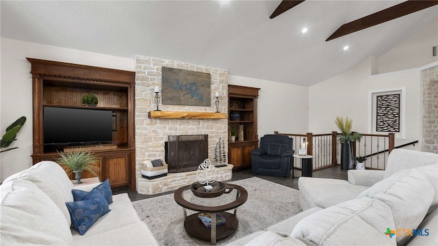 living room with a fireplace, beamed ceiling, and high vaulted ceiling