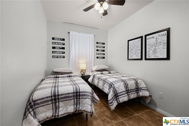 bedroom featuring ceiling fan, baseboards, and tile patterned floors