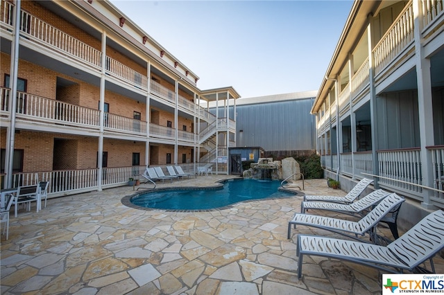 pool with a patio area