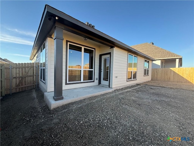 back of property with a patio area