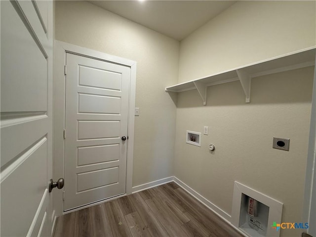 laundry area featuring dark hardwood / wood-style floors, gas dryer hookup, hookup for an electric dryer, and hookup for a washing machine