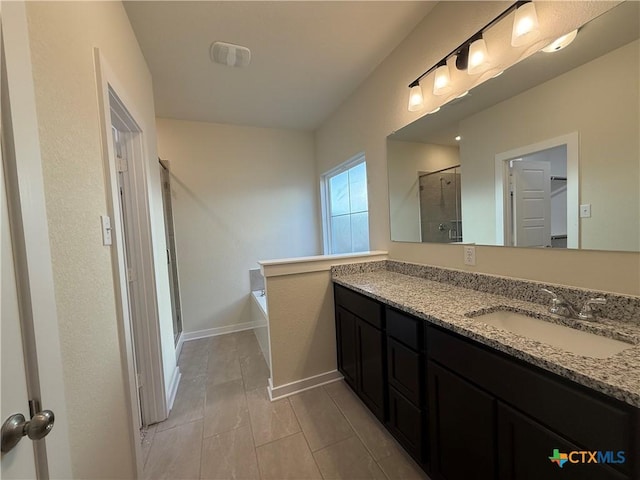 bathroom featuring shower with separate bathtub and vanity