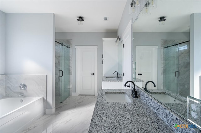 bathroom featuring vanity and separate shower and tub