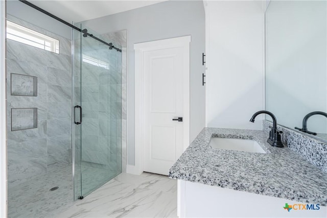 bathroom featuring vanity and walk in shower